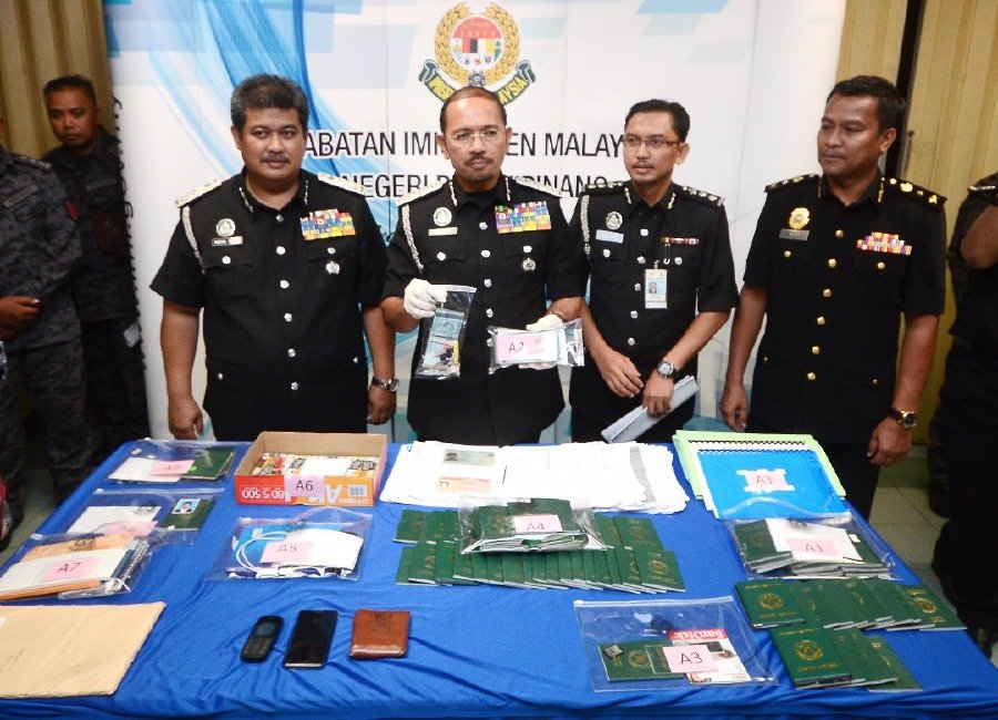 Busted Syndicate selling fake passport visit pass for as low as RM1500